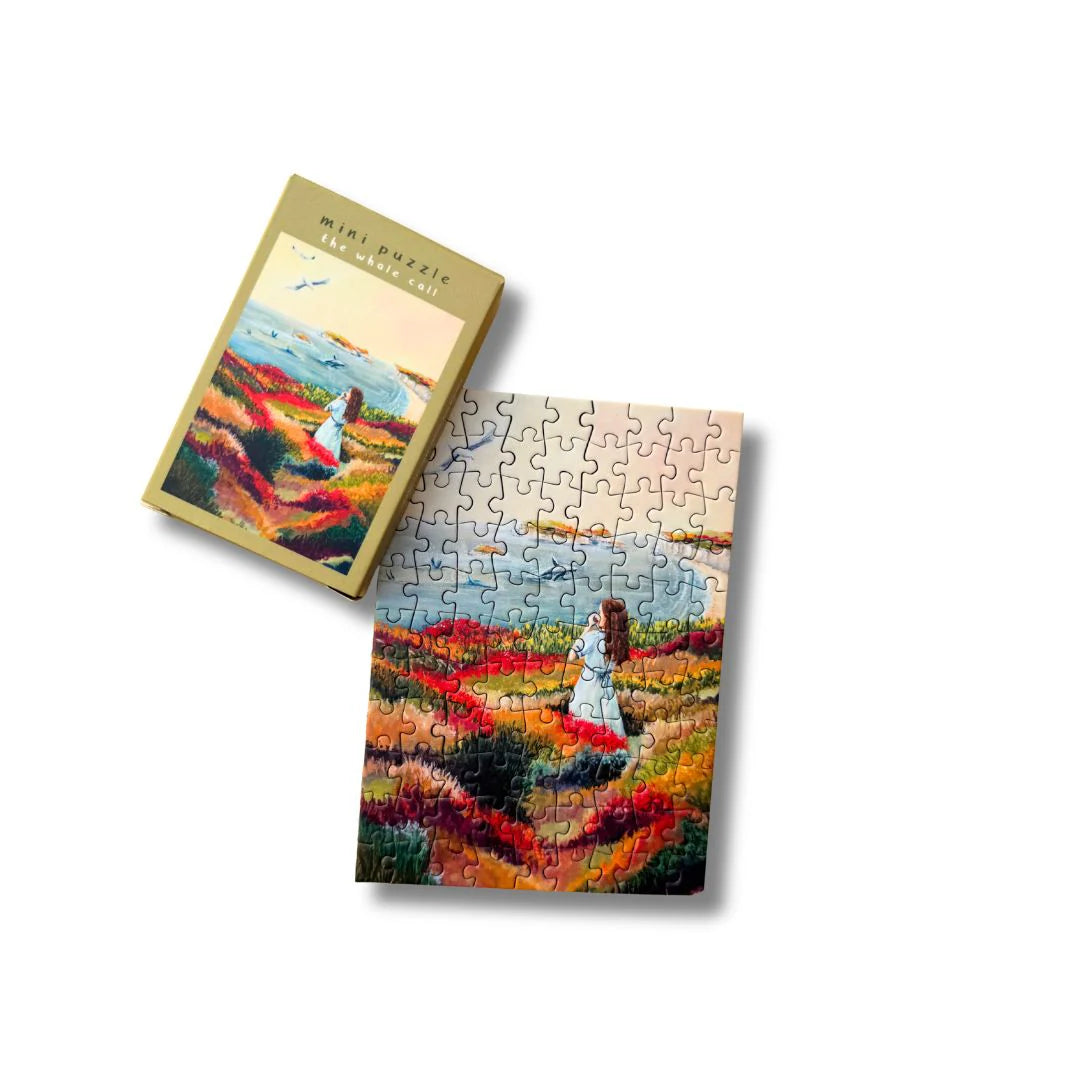 Minipuzzel Whale Call van Esther Bennink met illustratie van een walvis, verpakt in een compact doosje met 99 puzzelstukjes.